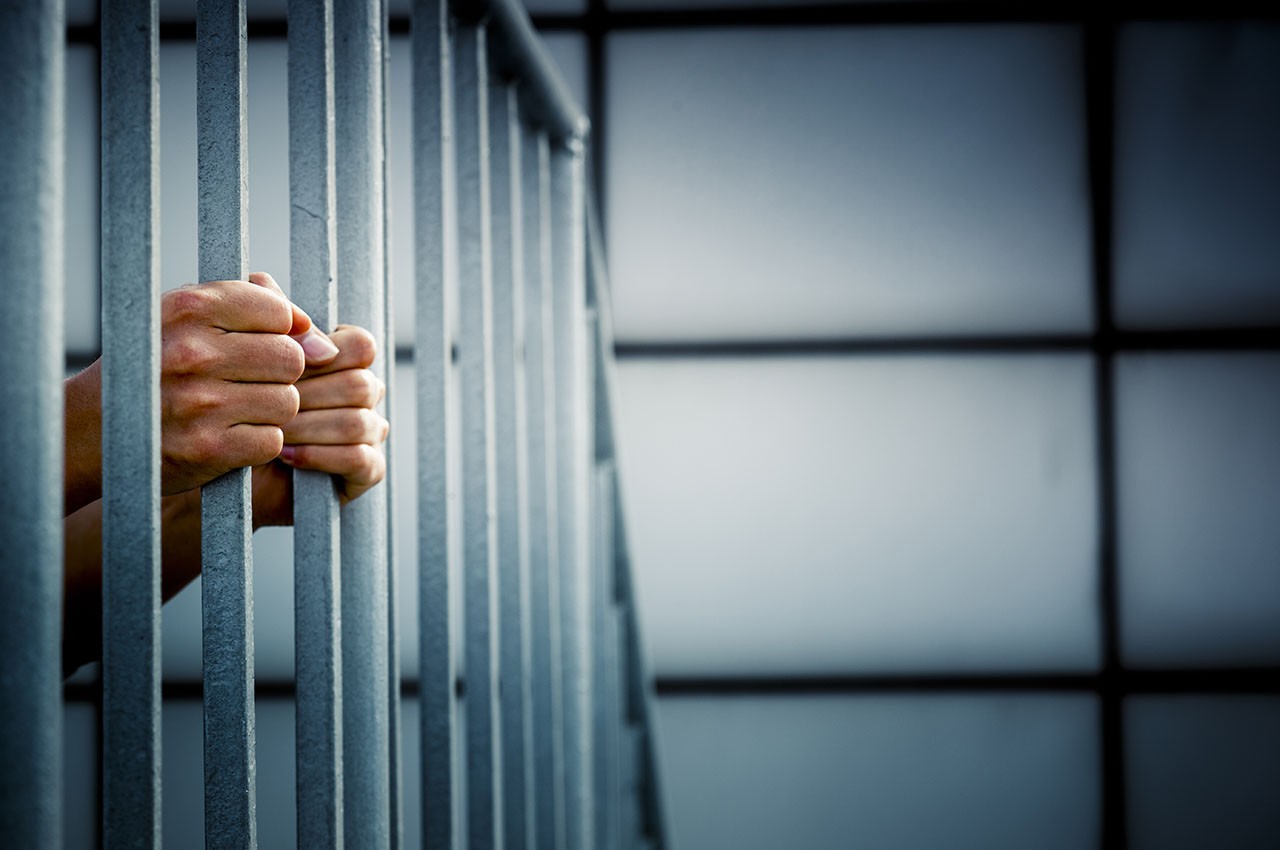 hands-on-jail-bars